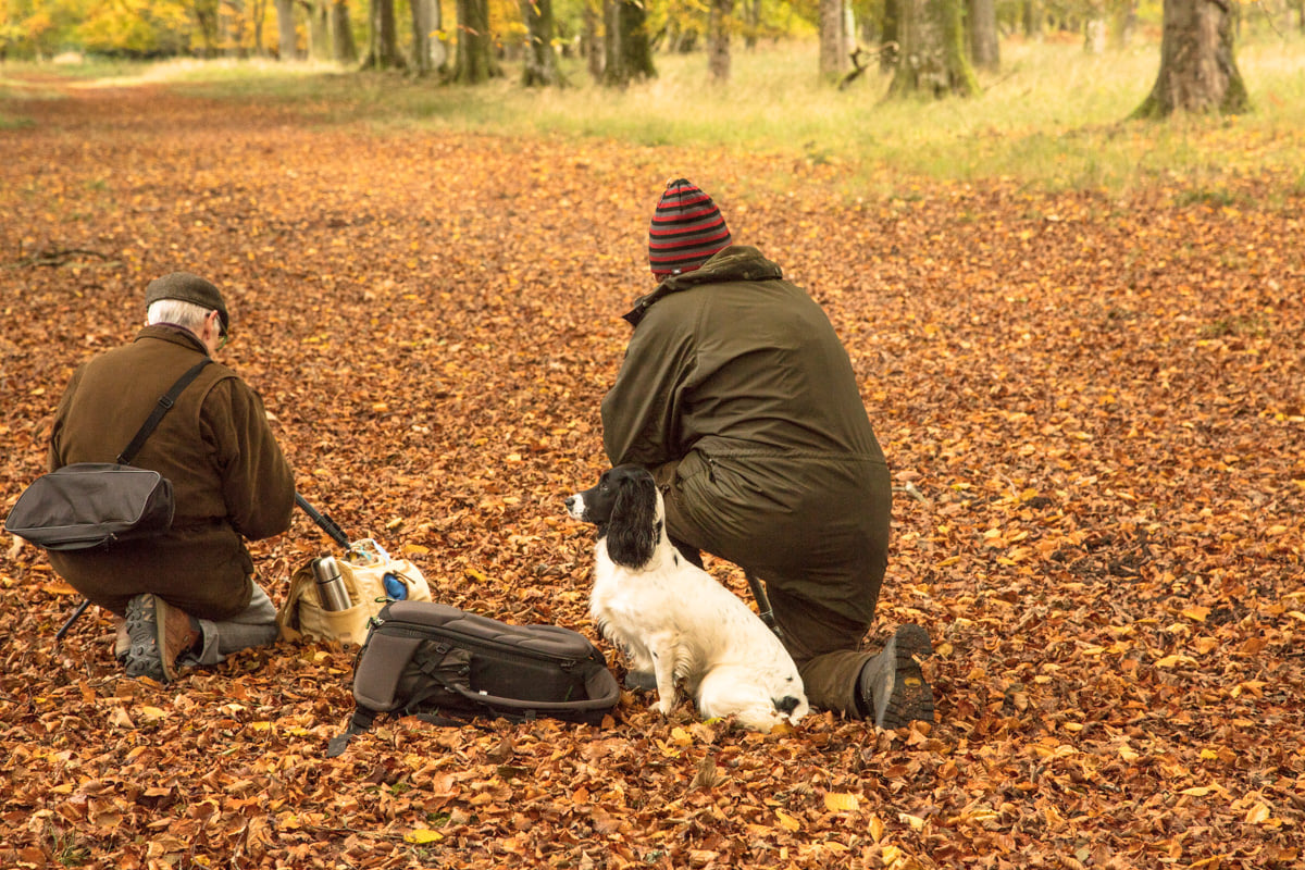 Photo of Adie and Meyrick preparing to take shots in the wood